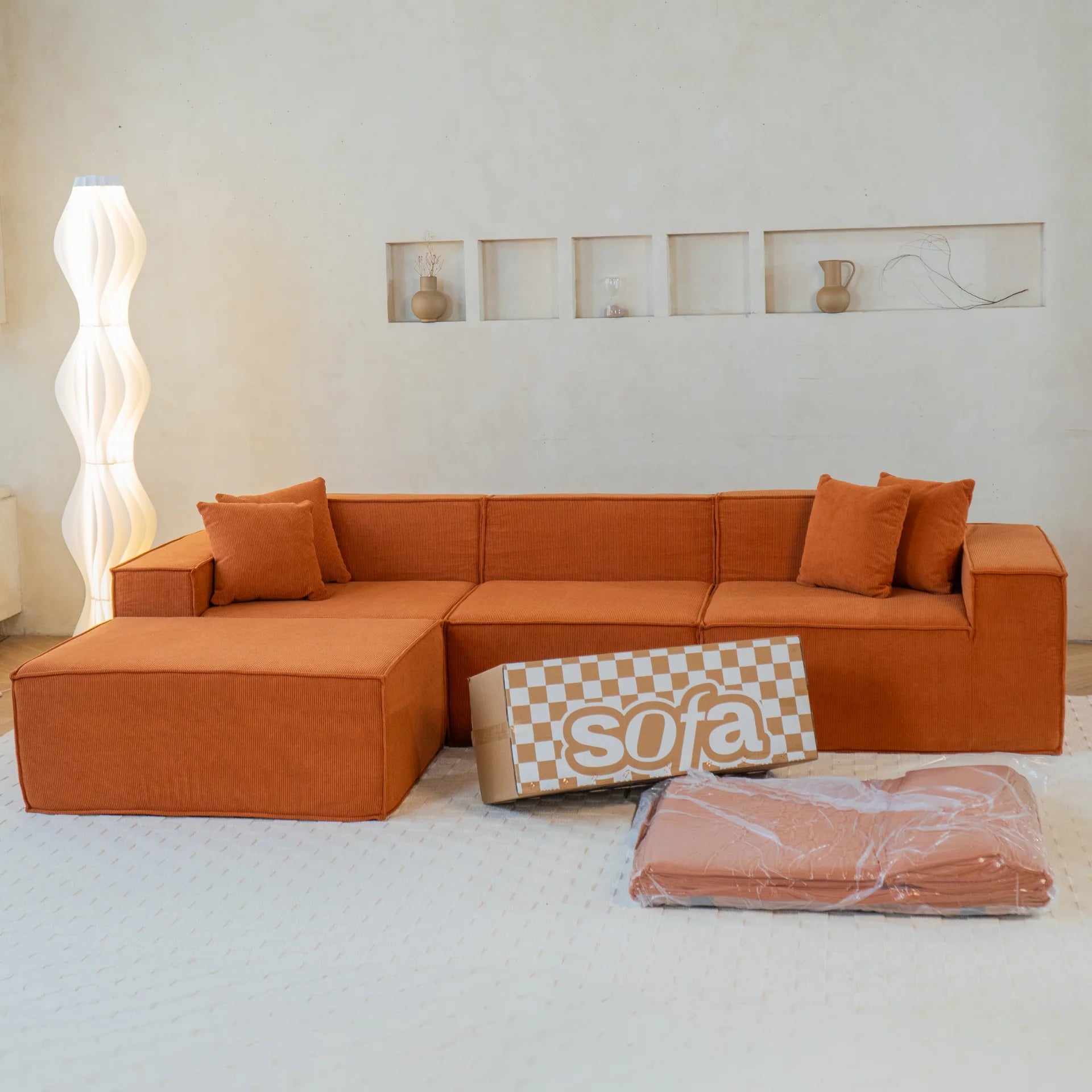 <tc>Sofa na Caixa</tc>  <tc>Pelion</tc> 3 assentos + 1 chaleiros no bujão - laranja